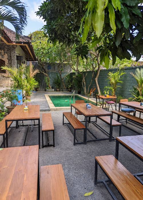Sanur Beer Garden, an open-air venue with vibrant umbrellas and cozy seating