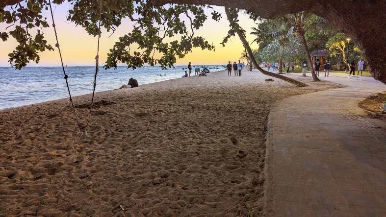 the beach front path in Sanur in the early evening
