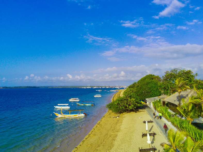People enjoying a walk along Sanur beach path