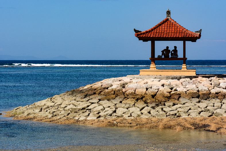 couple enjoying a serene and picturesque scene in Sanur, Bali