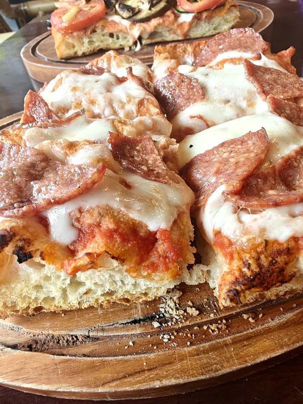 a thick crusted pizza from pizza gooo in Sanur