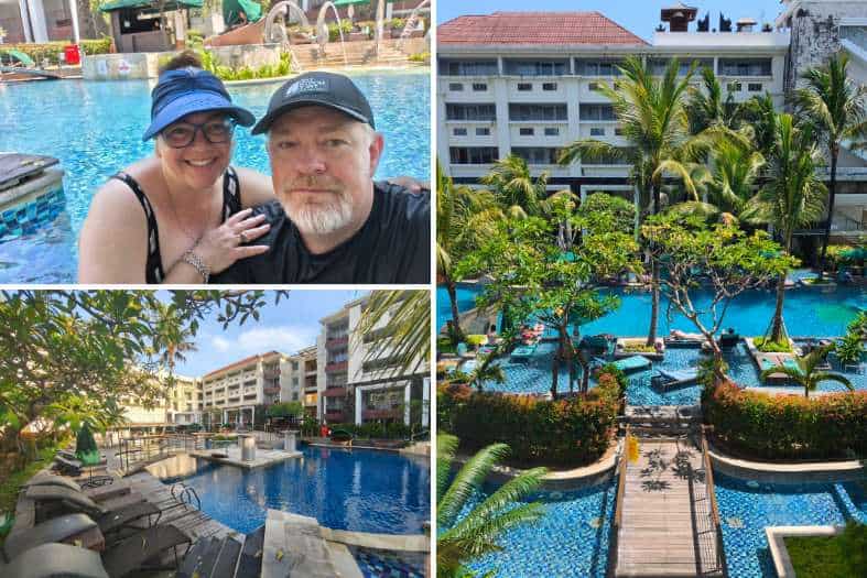 Tropical resort pool with greenery.
